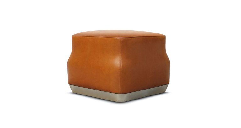 Eric Jourdan big stool in leather with the shape and the color of a caramel, with a silvered bottom