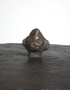 Front close up of the Him side table by Elizabeth Garouste, in brown patinated bronze 