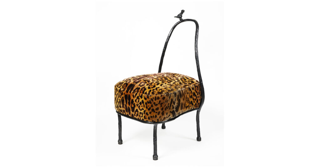 Eric Schmitt, chair in black bronze with a small bird in bronze, and a seat covered with a panther fabric