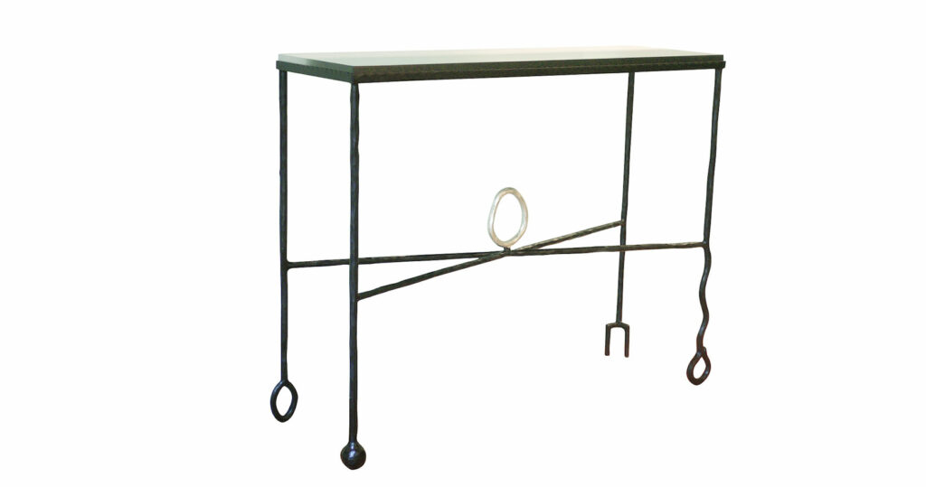Elisabeth Garouste, minimalist console table with straight black wrought iron legs finished at the bottom with graphic ornaments, and asilver central circle, dark wood top