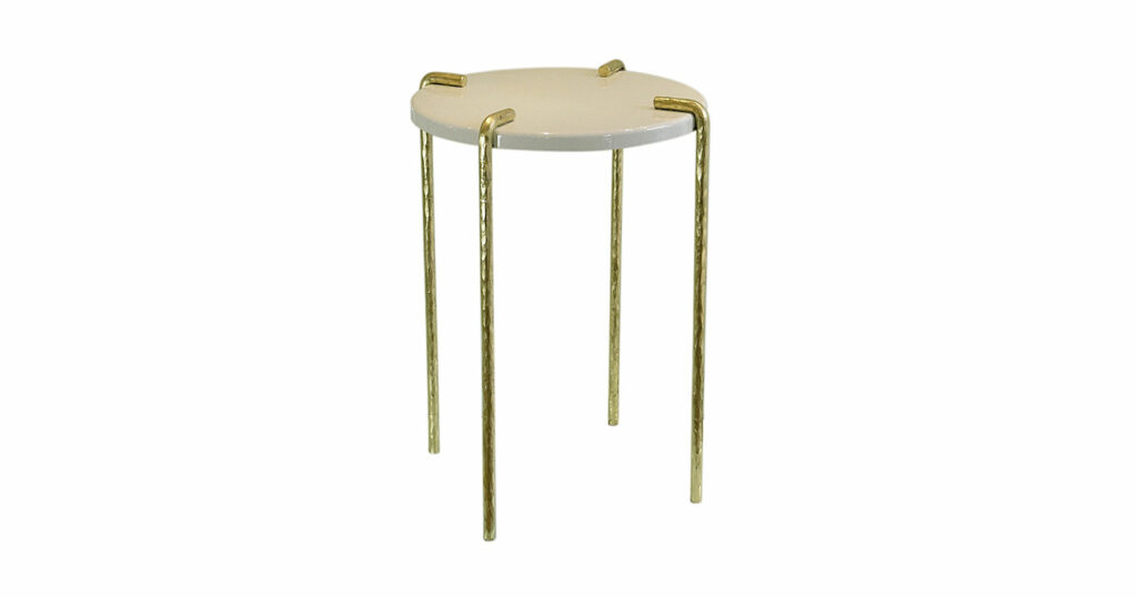 Eric Schmitt Small side table with four gilded wrought and beaten iron legs supporting a round top in white lacquered wood