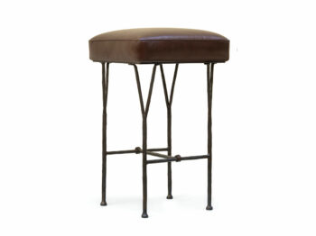 Garouste Bonetti, square minimalist bar stool with black wrought iron legs that split upwards into forks that support the upholstered brown leather seat