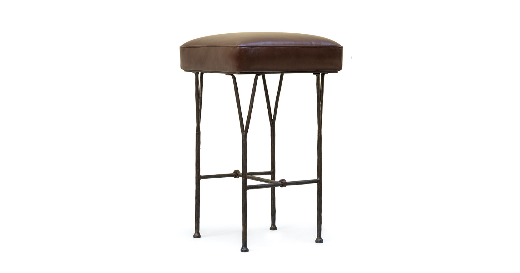 Garouste Bonetti, minimalist bar stool with black wrought iron legs that split upwards into forks and a brown leather seat