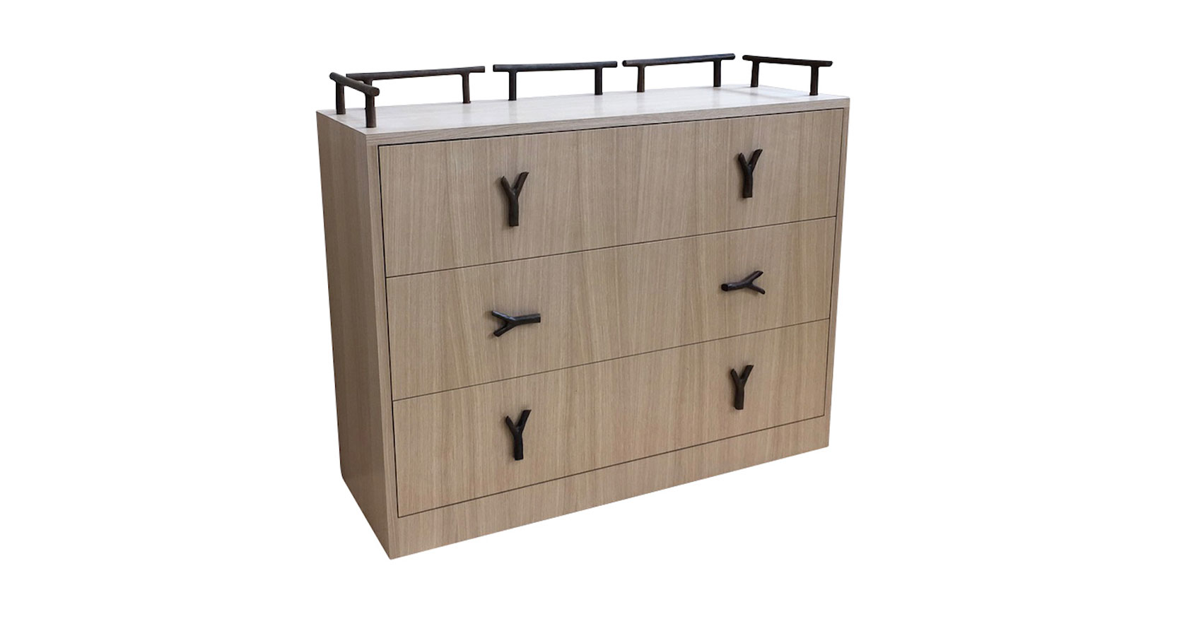 Garouste Bonetti, rectangular minimalist chest of drawers in light wood, 3 drawers each with two black bronze handles in the shape of forks, top surrounded by 5 black bronze rails