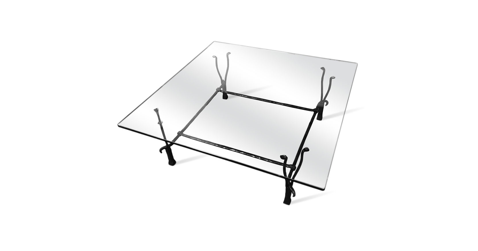 Garouste Bonetti, rectangular minimalist square coffee table, glass top, black wrought iron legs that divide into two forks that support the top