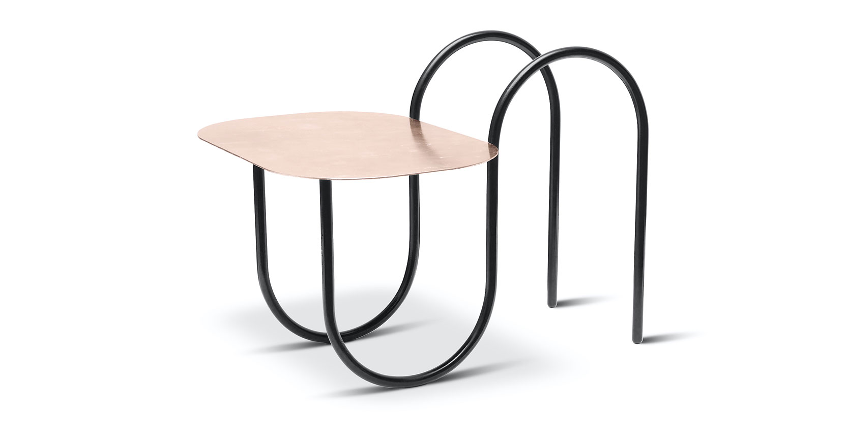 Margaux Kellers sculptural low side table structure in black patinated tubular section iron in a sinuous form that holds a rounded top gilded with pink gold leaf.