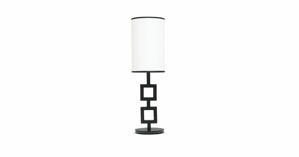 Elizabeth Garouste, minimalist lamp produced by an master craftsman with a circular base and stem consisting of two squares, one above the other, white cylindric lampshade black edged lampshade