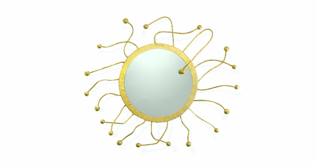 Elizabeth Garouste mirror evoking the sun. The gilded round frame is surrounded by a fringe of gold stems ending in small spheres.
