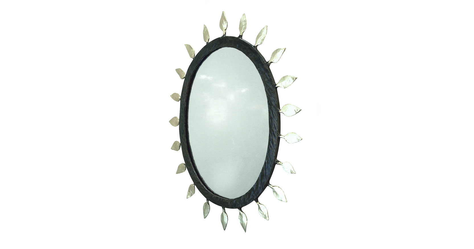 Garouste Bonetti, oval mirror in wrought iron with a brown frame surrounded by silvered leaves.