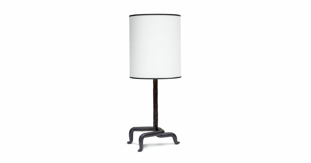 Mattia Bonetti, minimalist lamp, base in wrought iron with a centrale stem, 3 curved legs with 3 golden buttons