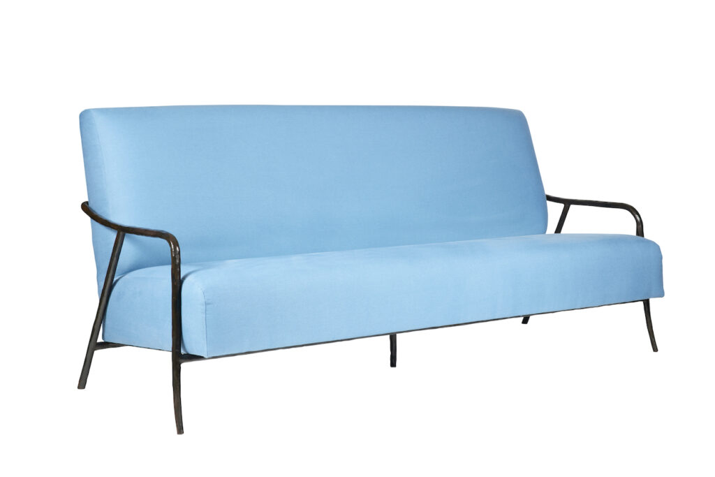 Eric Jourdan, large minimalist sofa with a black rounded wrought iron frame, blue velvet backrest and seat