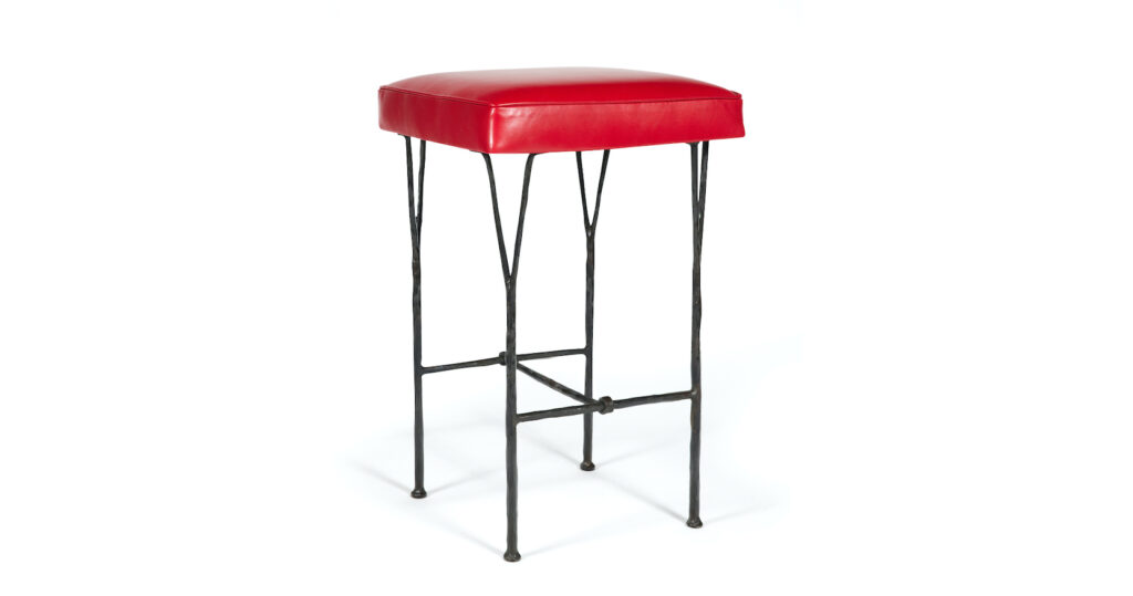 Garouste Bonetti, square minimalist bar stool with black wrought iron legs that split upwards into forks that support the upholstered red leather seat