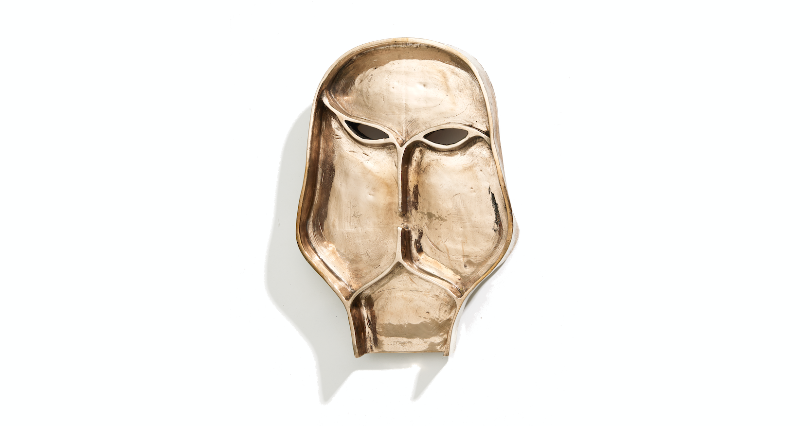 Eric Jourdan, artistic gilded bronze mask wall lamp, in the shape of a mysterious and antique face