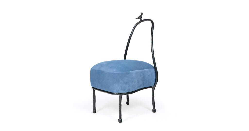 Eric Schmitt, low chair in black bronze, with a small bird at the top of the back, seat in blue fabric