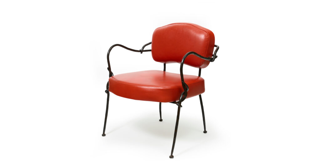 New design 2025, by Mattia Bonetti, in the spirit of the 50s, wrought iron armchair by the ironworker Diego Giacometti, legs and armrests in dark brown wrought iron, seat and backrest in bright red leather, for the Poetic Design exhibition at Artcurial