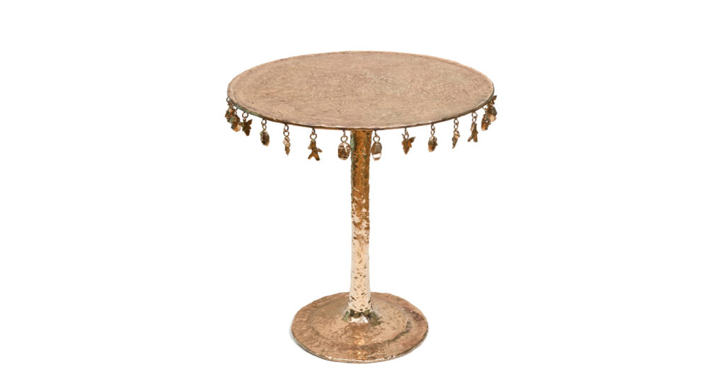 new 2025 creation of luxury design by Mattia Bonetti, baroque side table in golden bronze with round central leg, round top with hanging figurines, limited edition of 12 numbered copies