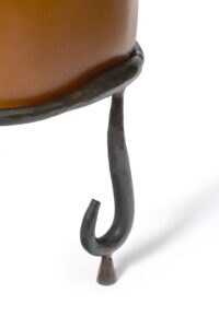 legs base Close up of the brown leather chair by Eric Schmitt, vintage creation of eric schmitt