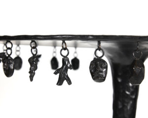 Close-up of the charms on Mattia Bonetti’s Osiris black bronze side table.